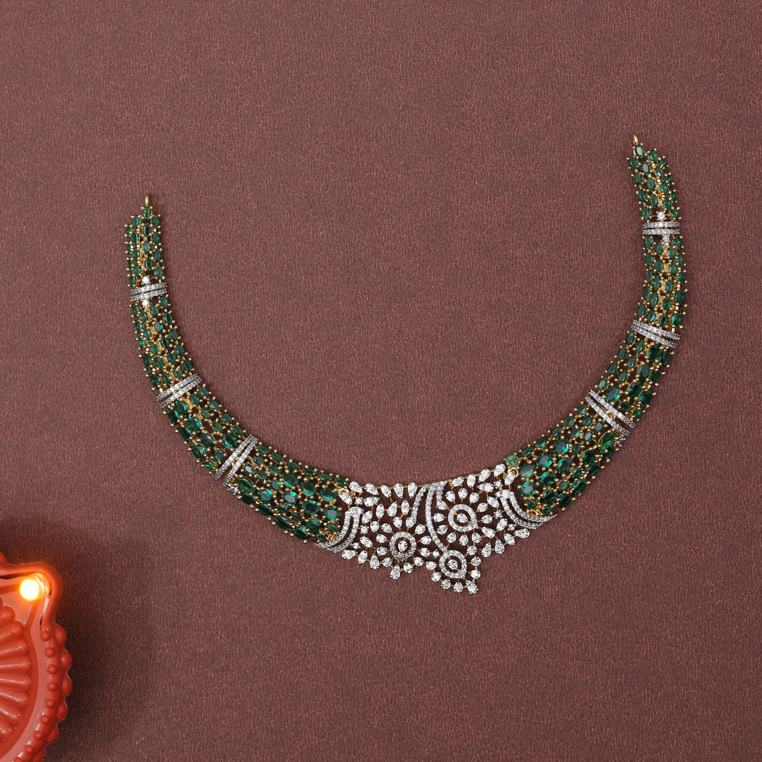 Jewelry set with necklace and earrings on a brown background